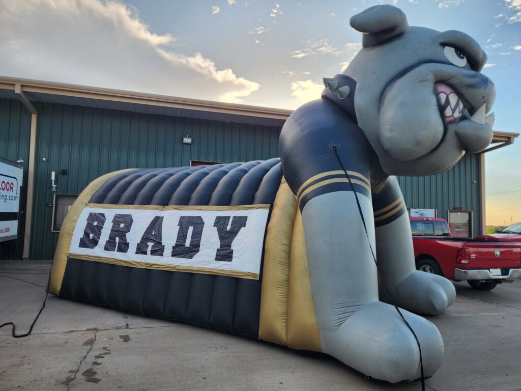 finished repairing the inflatable tunnels for Brady High School