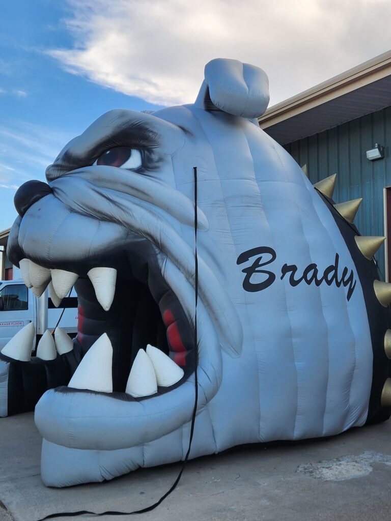 finished repairing the inflatable tunnels for Brady High School